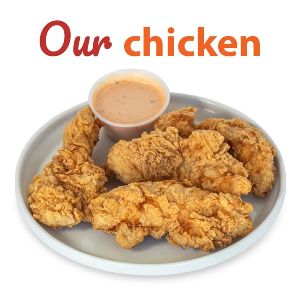 Connie's Chicken fried chicken tenders and dipping sauce on a white plate.